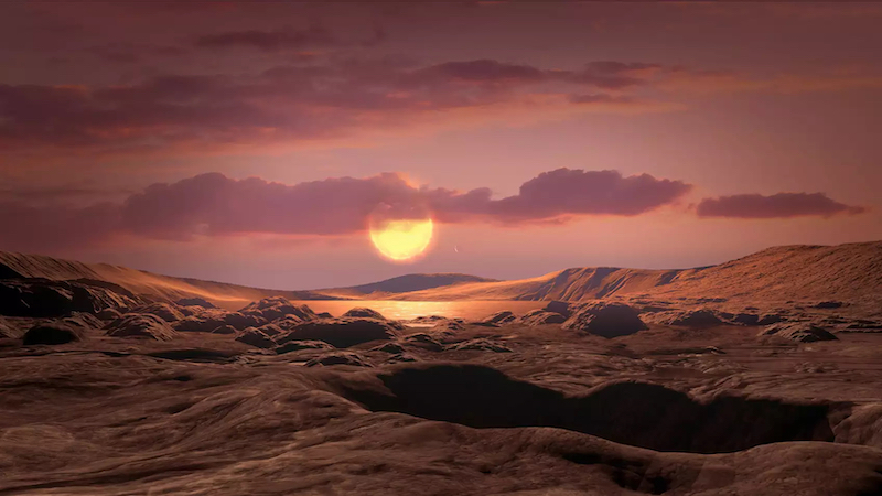 Earth-size exoplanet: Rocky landscape with large sun and clouds in the sky.