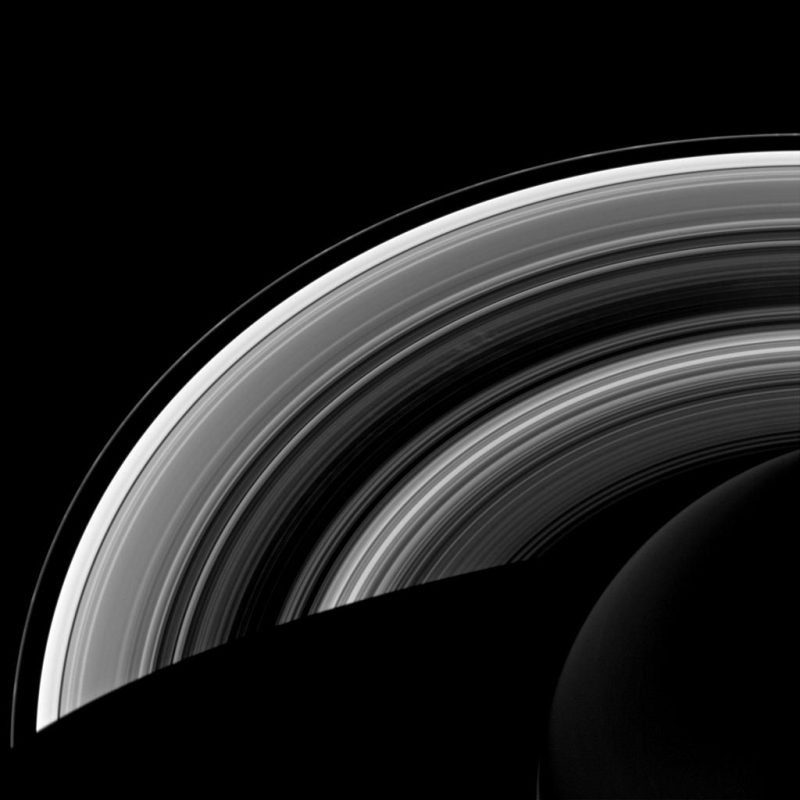 Image with different tones of Saturn's rings (black, white, gray).
