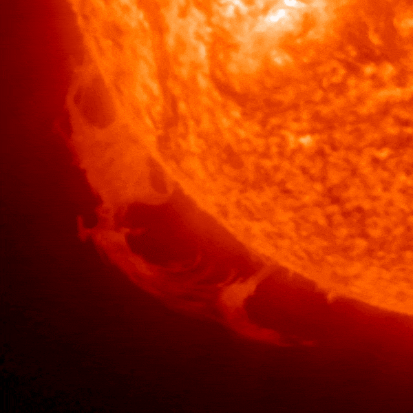 March 10, 2023, sun activity: Flare coming out of a red sphere. It comes back to the sphere creating an arc shape.