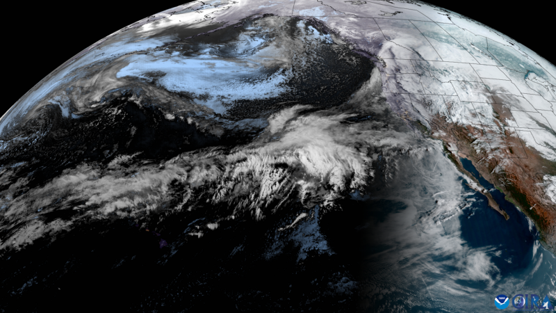 Earth seen from space, there are white clouds over California.