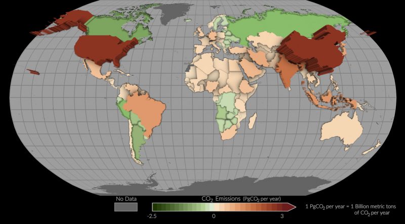 Carbon dioxide emissions: Map of world with different countries' carbon dioxide emissions in shades of green and orange.