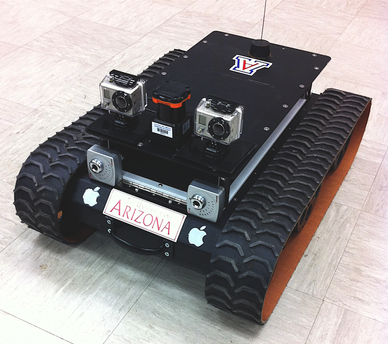 Small robotic rover with tractor-like treads for wheels and 2 cameras.