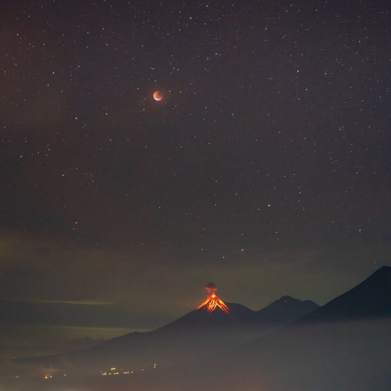 Medieval monks observations: Reddish moon and stars above erupting volcano.