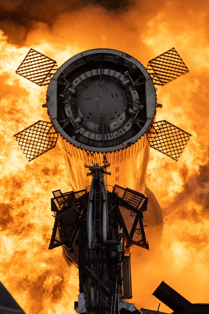 SpaceX Starship Super Heavy Chrome cylinder surrounded by fire