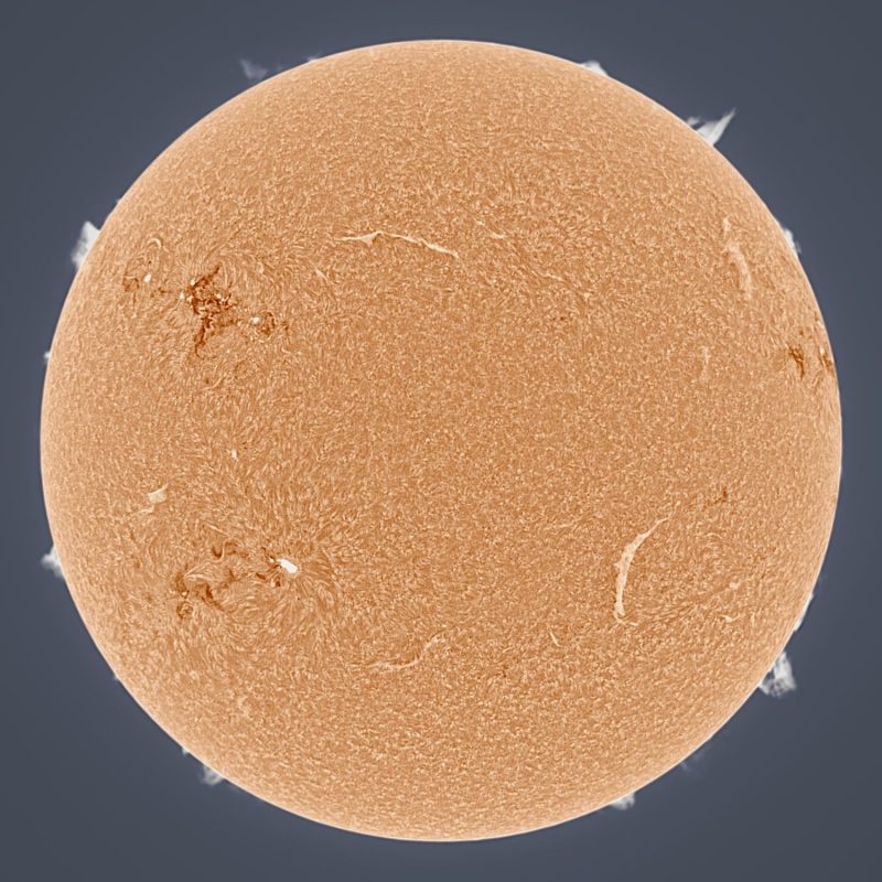 The sun, seen as a large orange sphere with a mottled surface.
