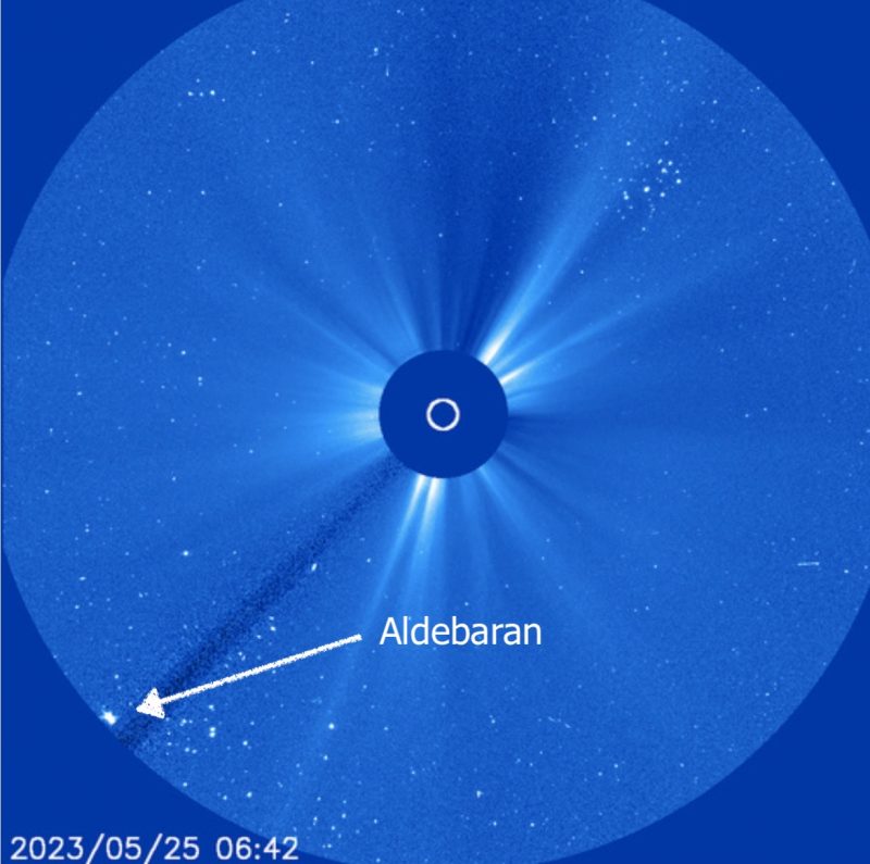May 25, 2023 A blue image shows a dark circle covering the sun and a brilliant star at bottom.