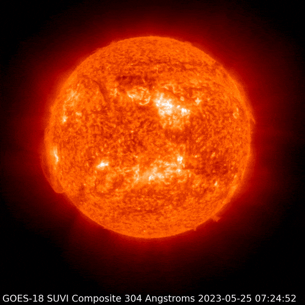 May 25, 2023 A red sun shows a couple of prominences on the southwest.