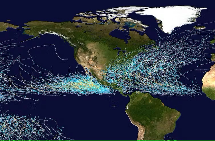2023 hurricane forecast: Map centered on Central America and showing colorful tracks on both sides in the oceans.