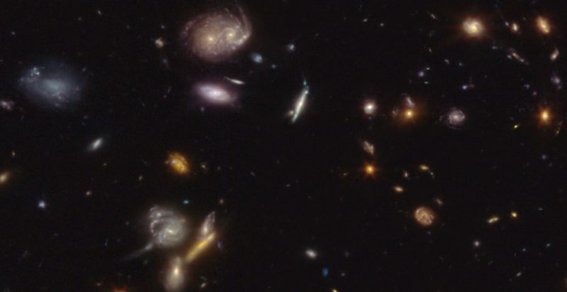 An array of galaxies of all shapes and sizes and colors.