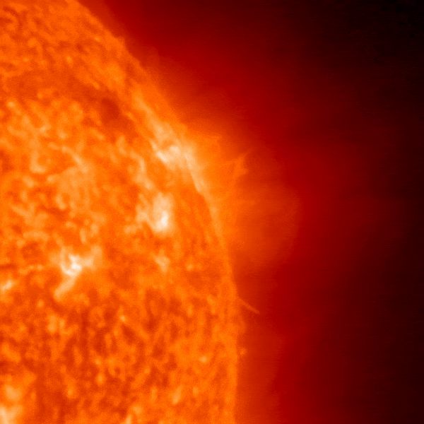 A red upper quarter of the sun shows a bright explosion.