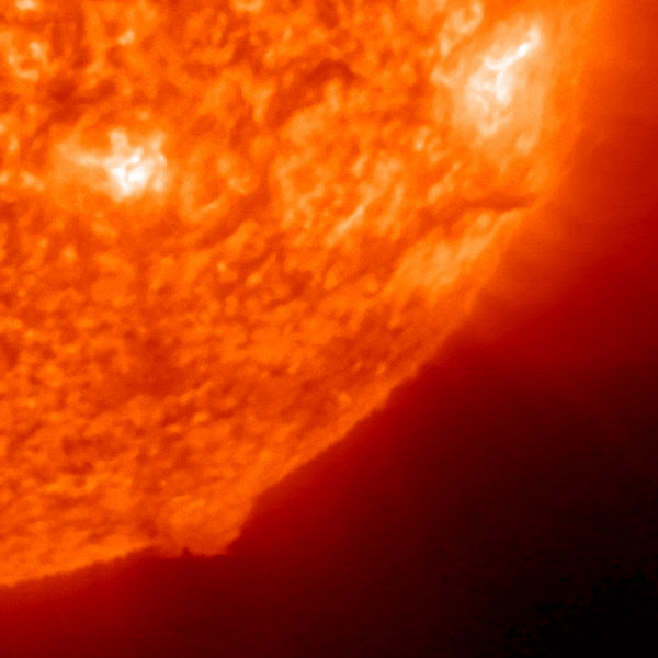 An animation showing a portion of a red sun while exploding a CME.