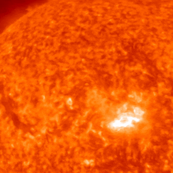 A portion of a red circle showing a sun exploding filament.