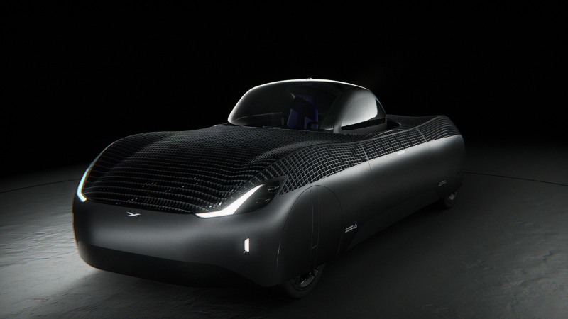 Sleek black car with angled lights and small passenger compartment.