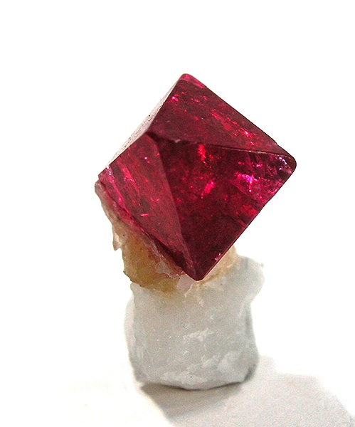Crystal of reddish-pinkish spinel.