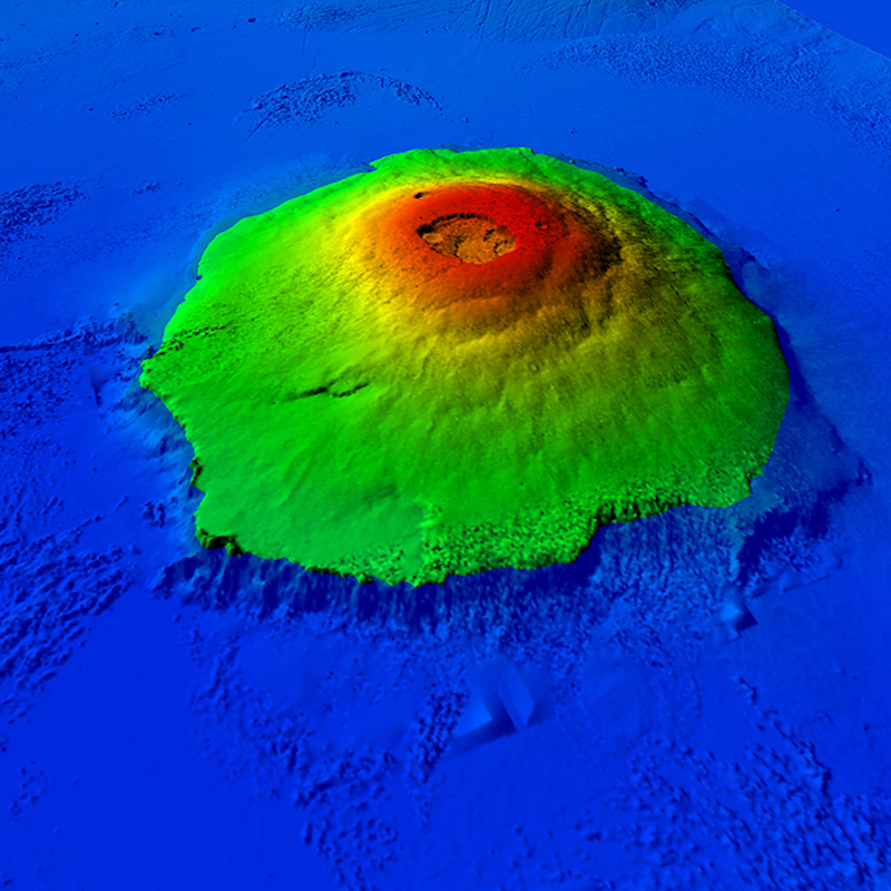 Olympus Mons: Oblique orbital view of volcano-like structure in green and red false color surrounded by blue water.