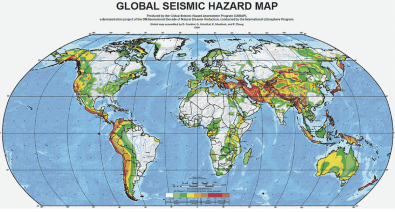 Map of world, with earthquake danger zones marked in red, orange, and green.
