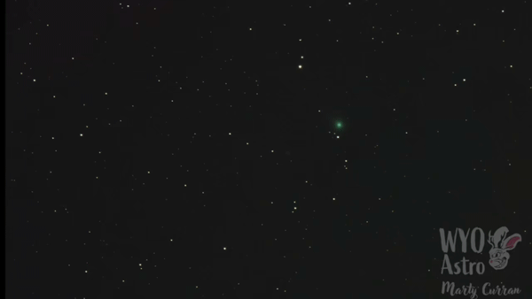 Short animated photo with tiny, fuzzy green spot moving relative to star field.