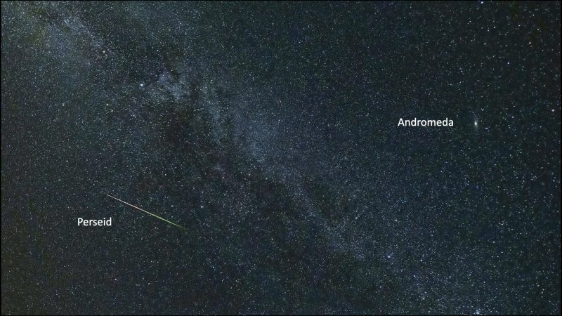 Colorful bright streak against Milky way, with a fuzzy dot labeled Andromeda.