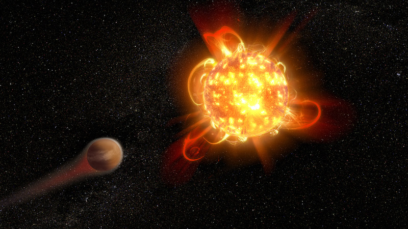 Red star with many loops of bright material coming off it and a planet nearby with 'tail' of gases.