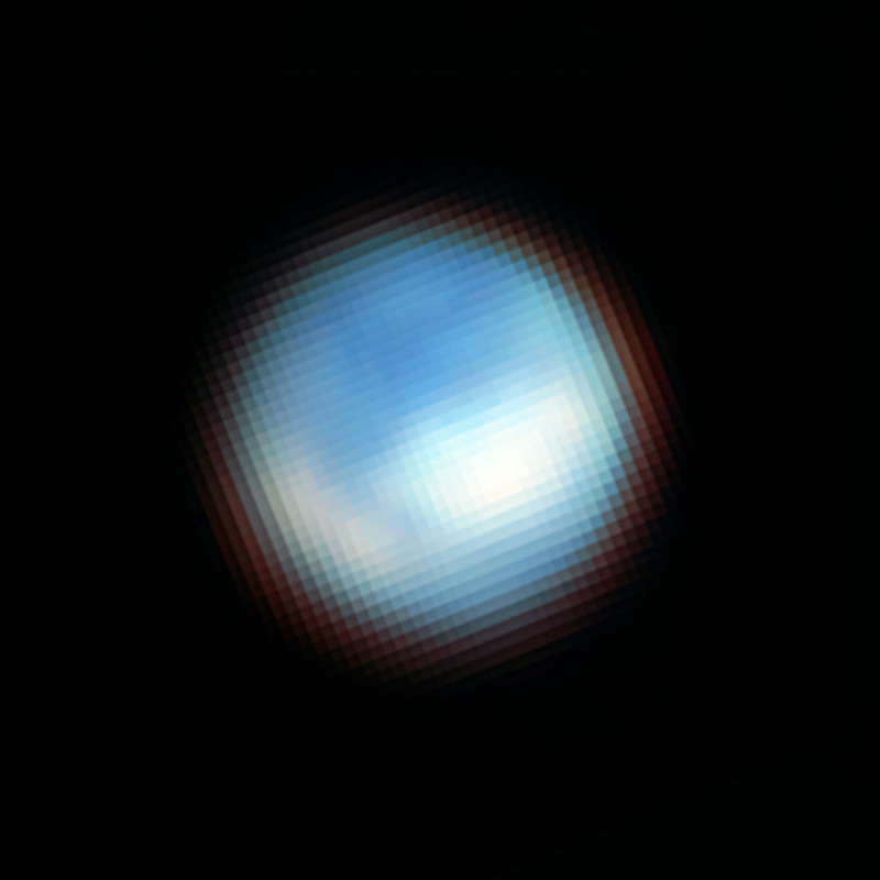Europa's carbon dioxide: Light blue and white, very pixelated sphere on black background.