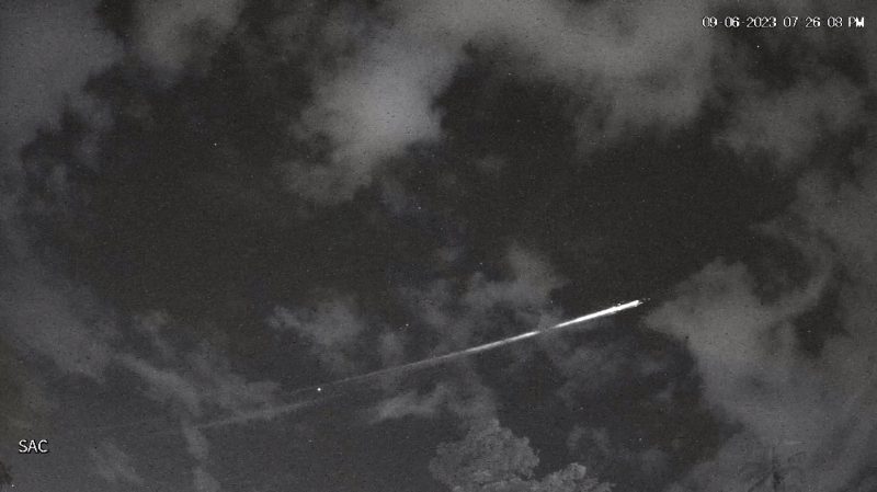 Starlink satellite disintegrating: still frame showing a bright white line behind the clouds.