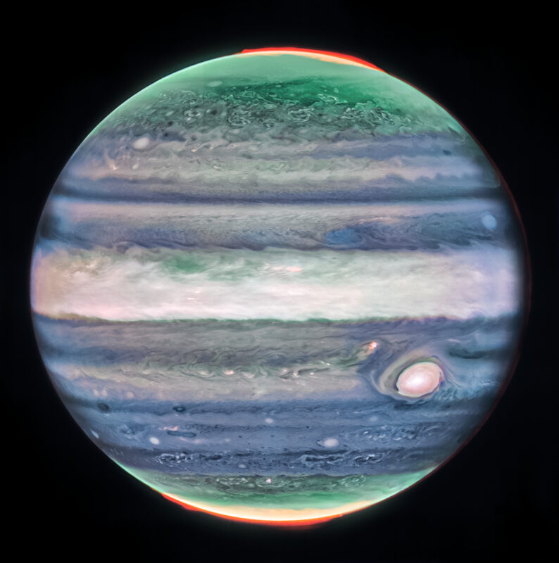 Jupiter with green and blue bands and a pale wide stripe at center plus a large, pale spot.
