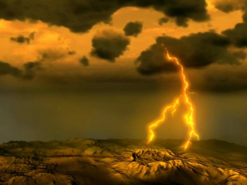 Lightning on Venus: Dark brooding clouds with brilliant forked streak of light hitting the barren ground below.