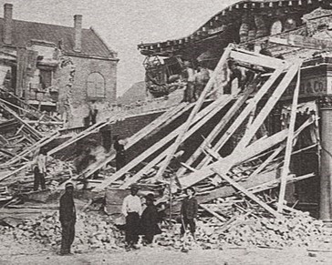Black-and-white photo showing collapsed buildings after Charleston, SC, earthquake, with people looking on.