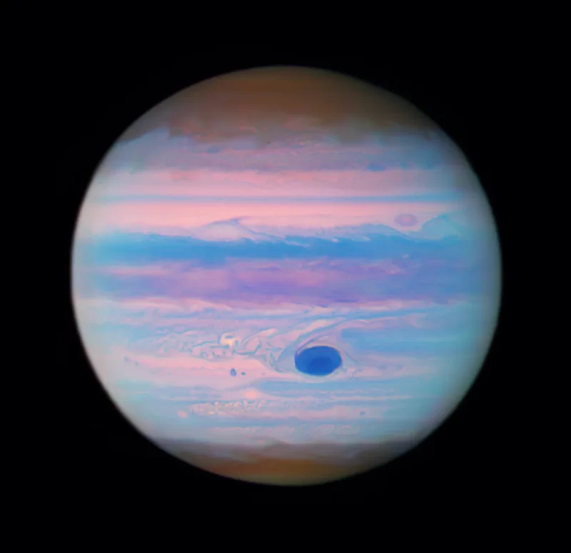 Giant planet Jupiter in hues of purple and blue.