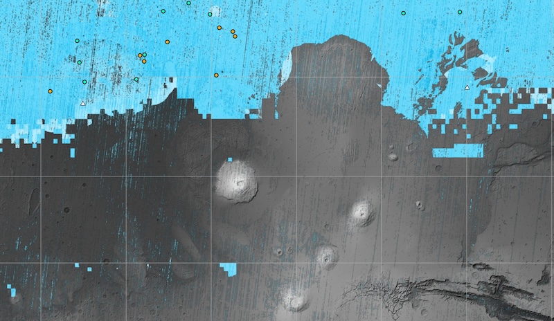 Ice on Mars: Gray and blue map with grid lines and 4 large volcanoes viewed from orbit in gray area.