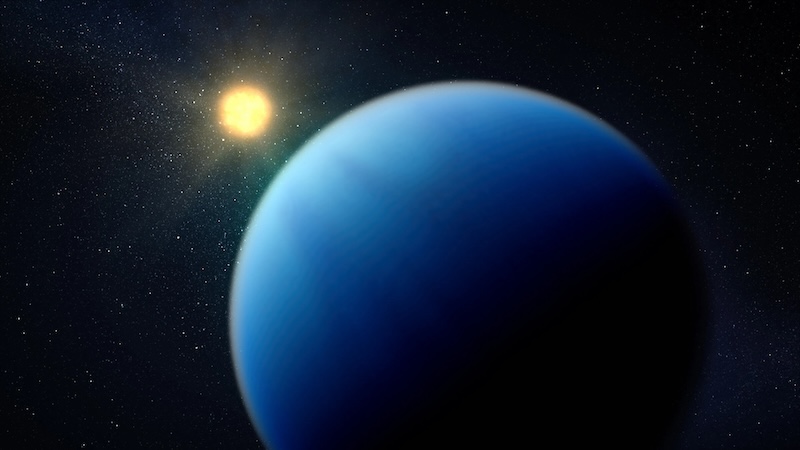 Shrinking exoplanets: Large blue planet with faint clouds and a bright yellow star nearby.