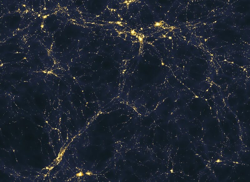 Universe may be younger: Black background with yellow lights forming an irregular web.