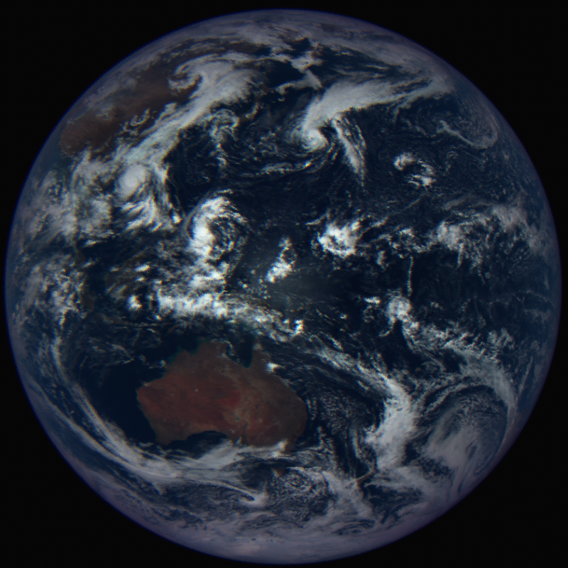 A view of our entire planet, in muted tones. Reddish Australia is visible to the lower left.