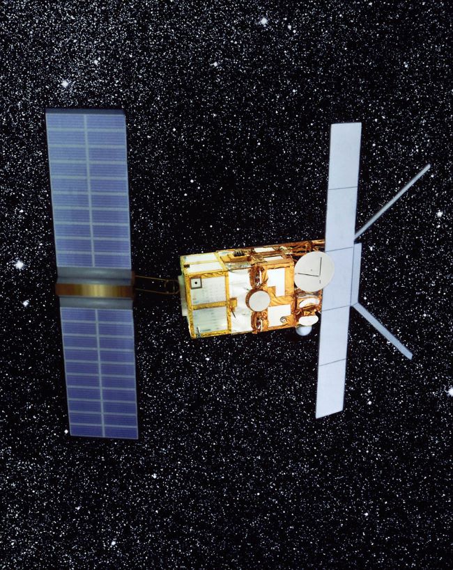 Dead satellite: Starry background with a metallic box with wide solar panels at each end and antennas.
