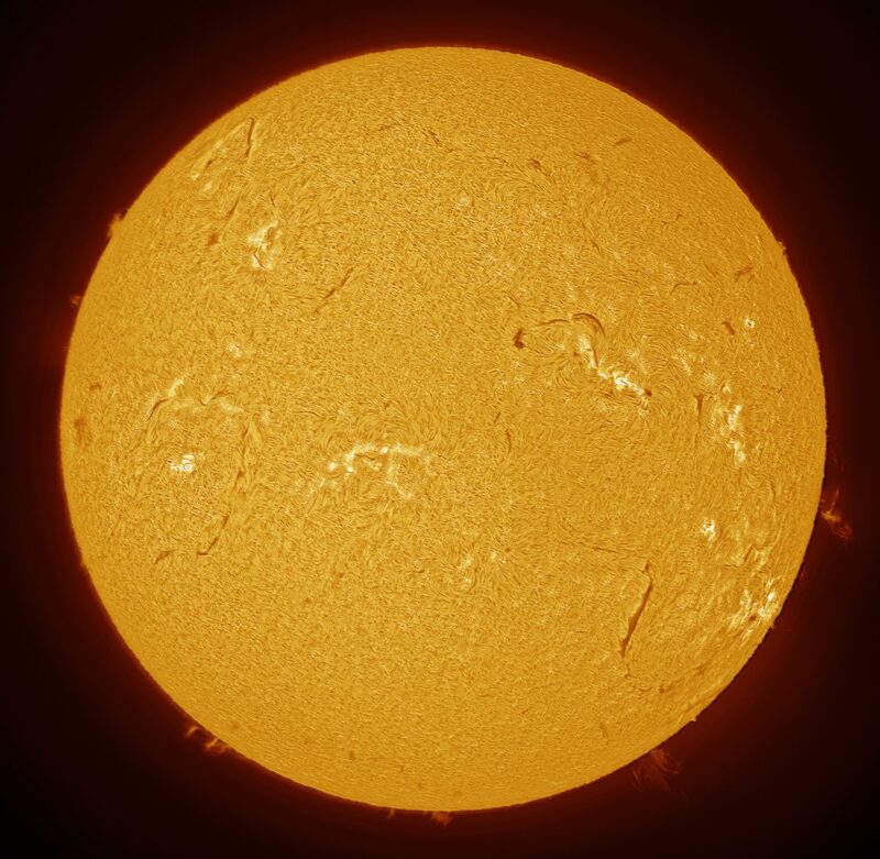 The sun, seen as a large yellow sphere with a mottled surface.