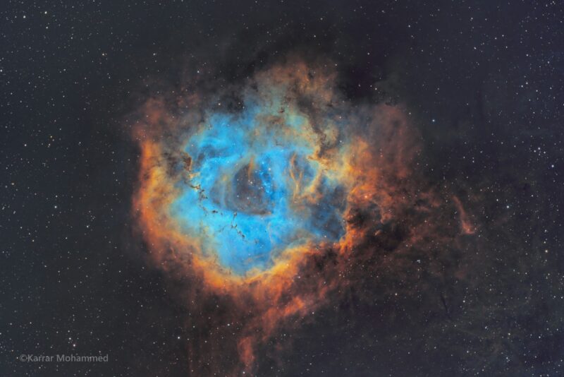 The shape of a rose in the deep sky. The exterior is orange, followed by yellow and blue.