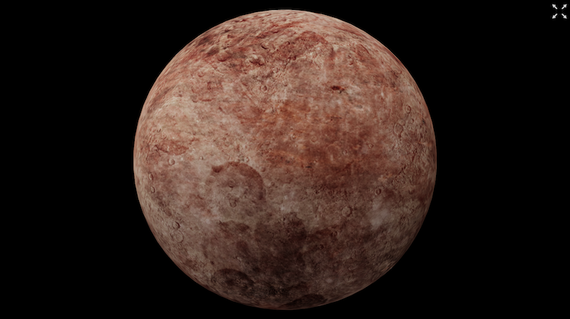 Brown planet-like body with rough surface, craters, and reddish blotches and streaks.