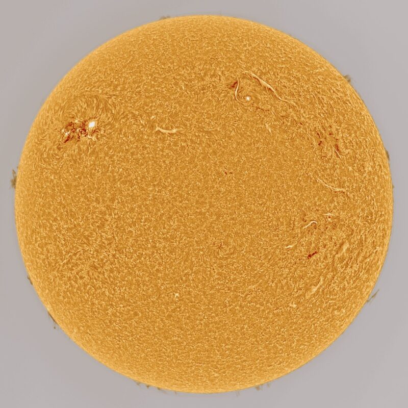 The sun, seen as a large yellow sphere with a mottled surface.