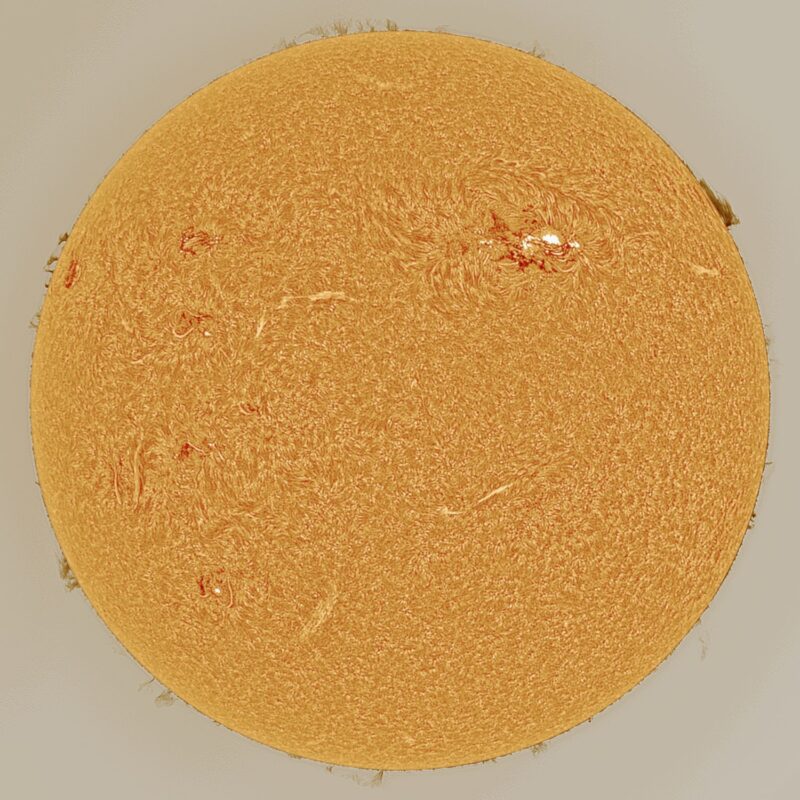 The sun, seen as a large yellow sphere with a mottled surface.