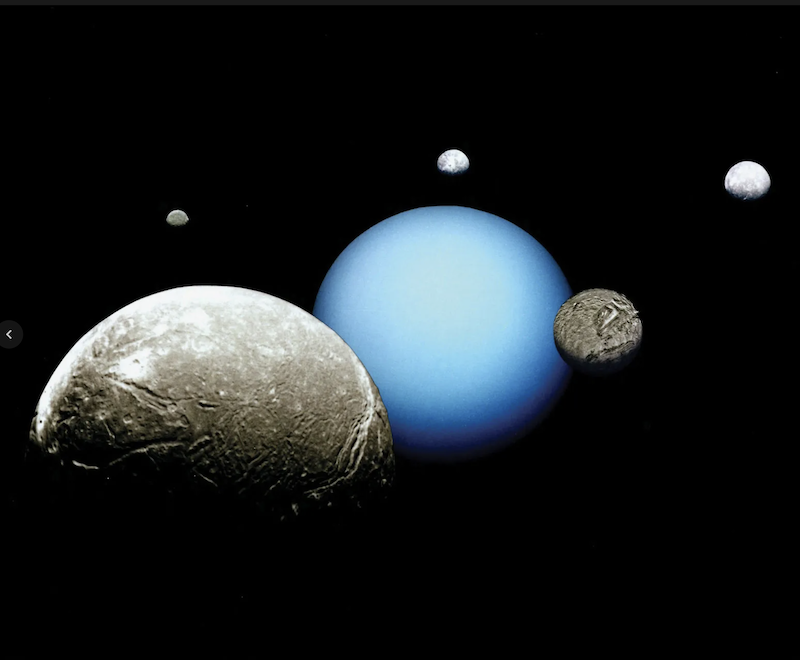 Sky-blue planet with 5 gray or white moons of varying sizes around it.