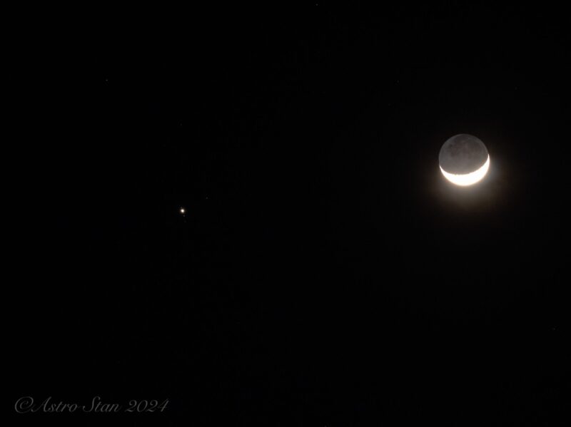 Moon and Jupiter: Bright crescent moon with a dot and four tiny dots around it in a straight line.