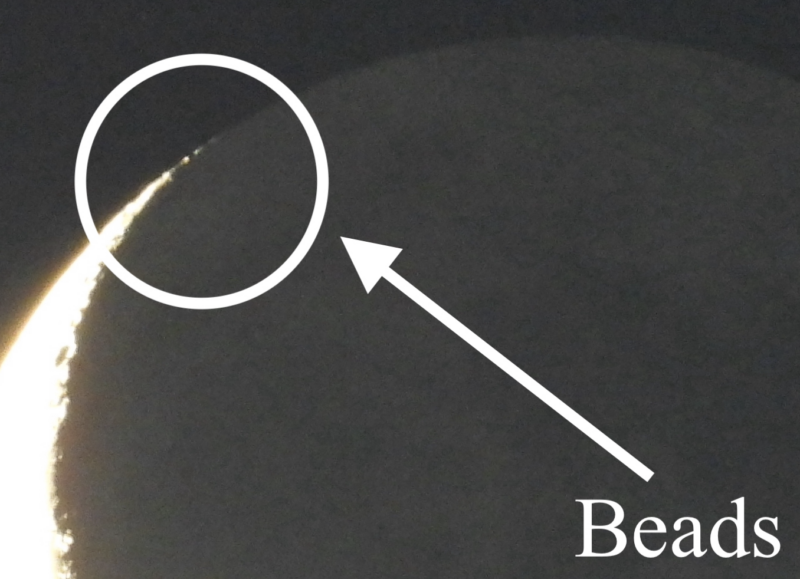 The very tip of the glowing crescent moon. A line of dots of light labeled Beads is visible.