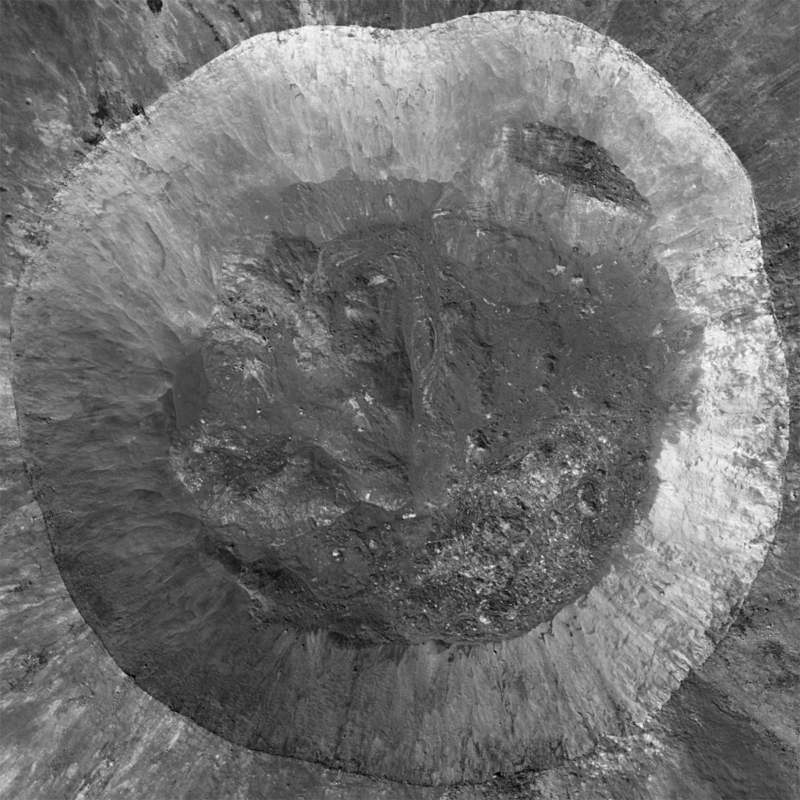 A nearly circular, grey-colored moon crater.