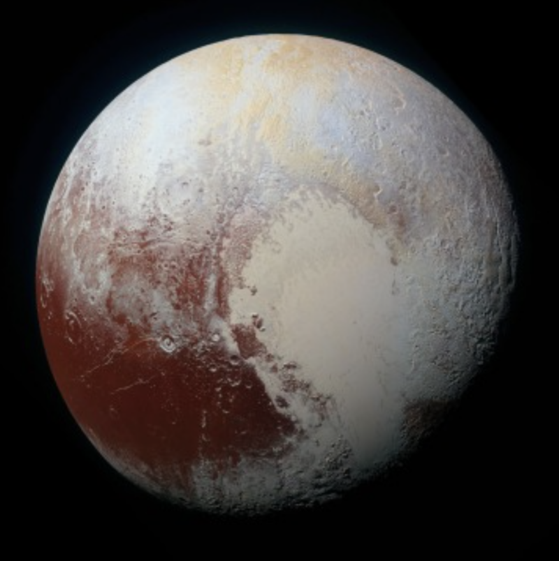 How Pluto got its heart: Round globe with large, light-colored heart-shaped feature.