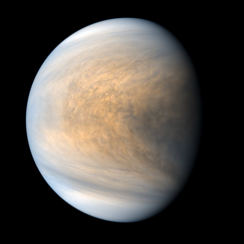 Venus' atmosphere: Planet with multicolored clouds in a v-shaped formation.