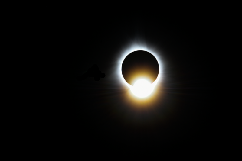 Total solar eclipse pics: A black circle with a bright rim and one bright flash at the bottom.