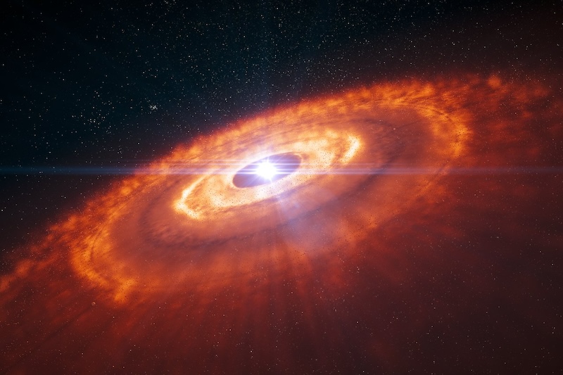 Series of bright orange, diffuse concentric rings surrounding a bright white spot, with stars in background.