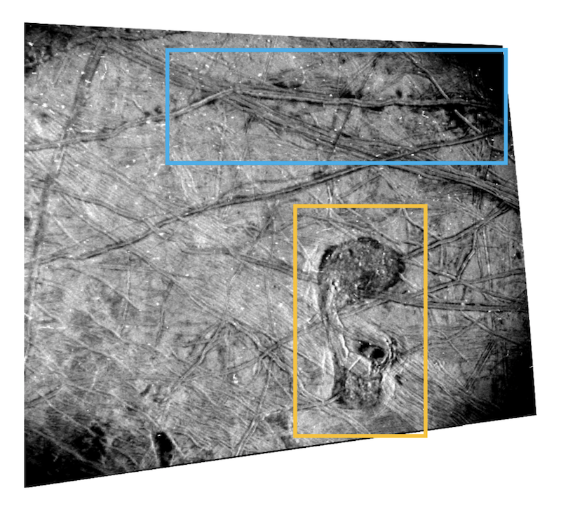 Gray terrain inside an uneven square with cracks and ridges, a blob shape, yellow rectangle and blue rectangle.