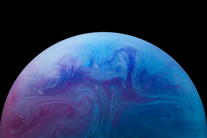 Planet 9 representation: Bluish purple planet with some swirls.