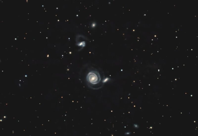 Deep-sky photos: A quartet of whitish nebulous spirals with a foreground of bright stars.